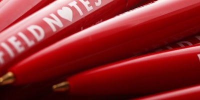 Group of red Field Notes pens